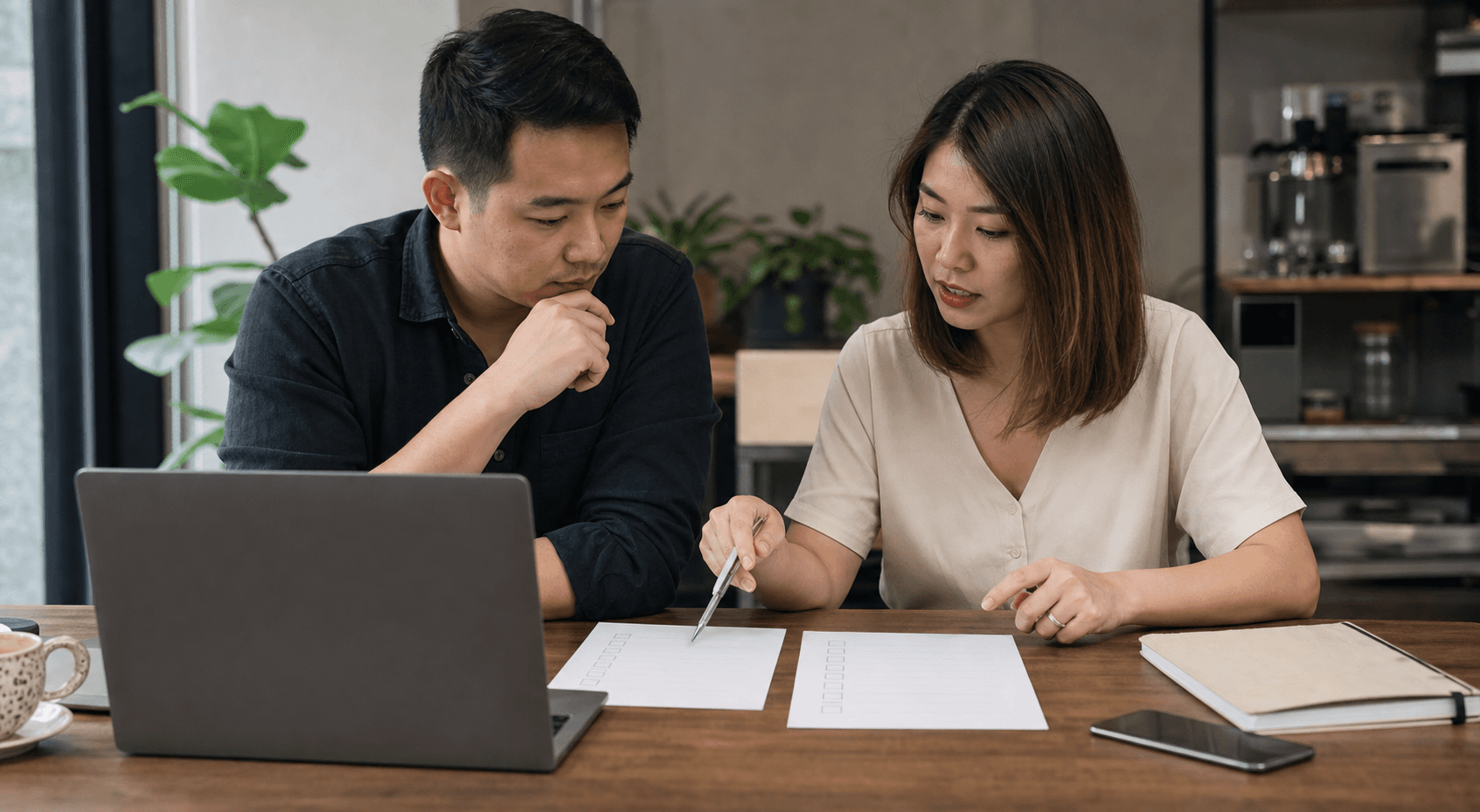 Singapore SME founder and marketing manager comparing SEO audit and AI search audit checklists.